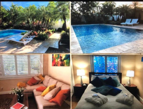 Private bedroom & den suite with shared pool & tropical garden